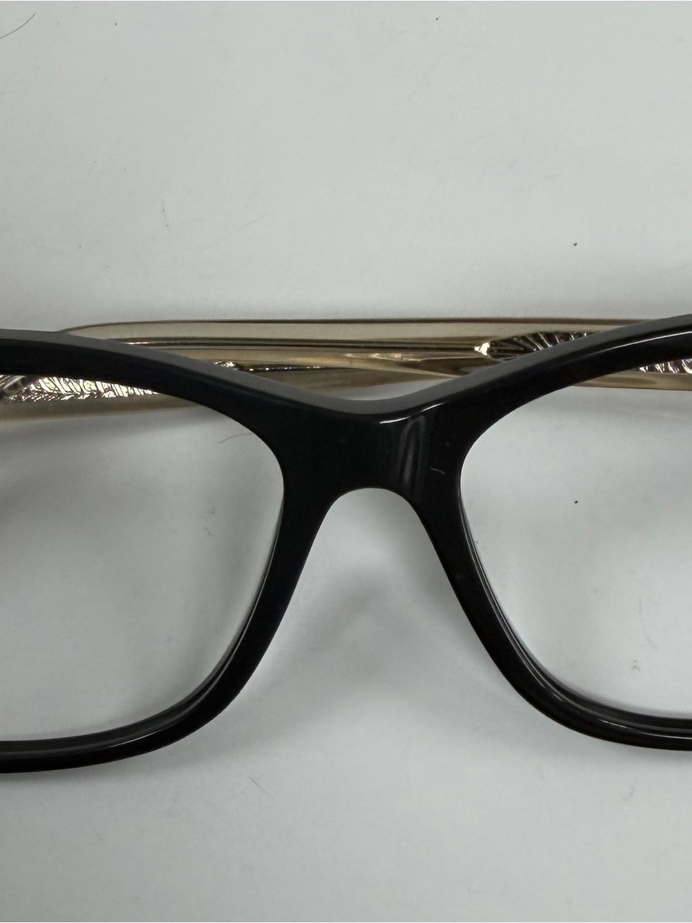 Maui Jim Women's Black Frame Glasses with Gold Temples and Detail